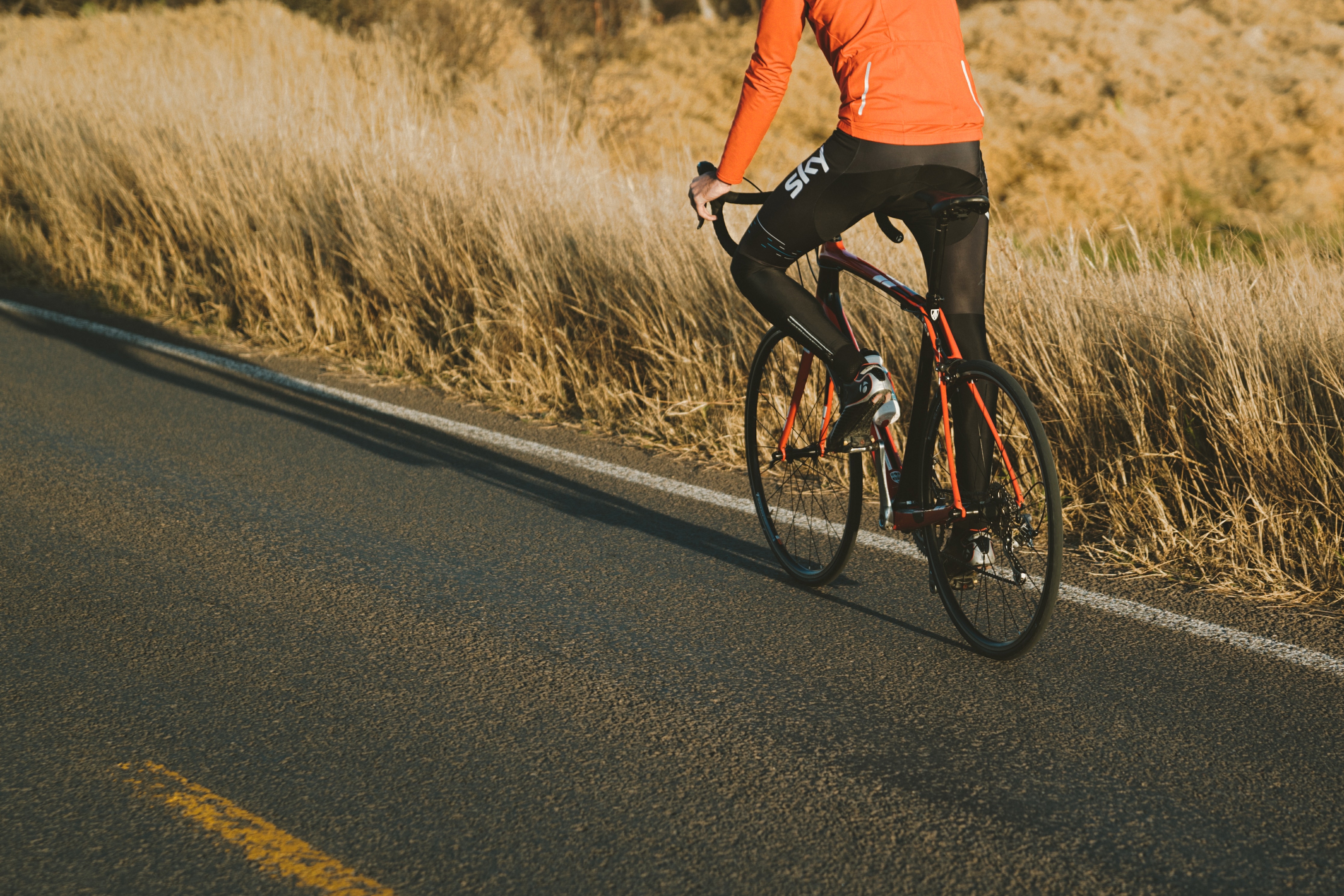 Person cycling on road